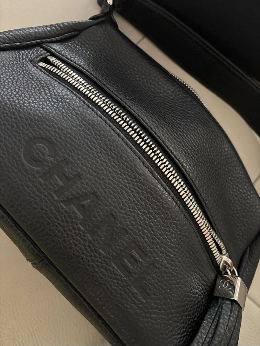 CHANEL Black Pebbled Leather Shoulder Bag with Tassel Zip